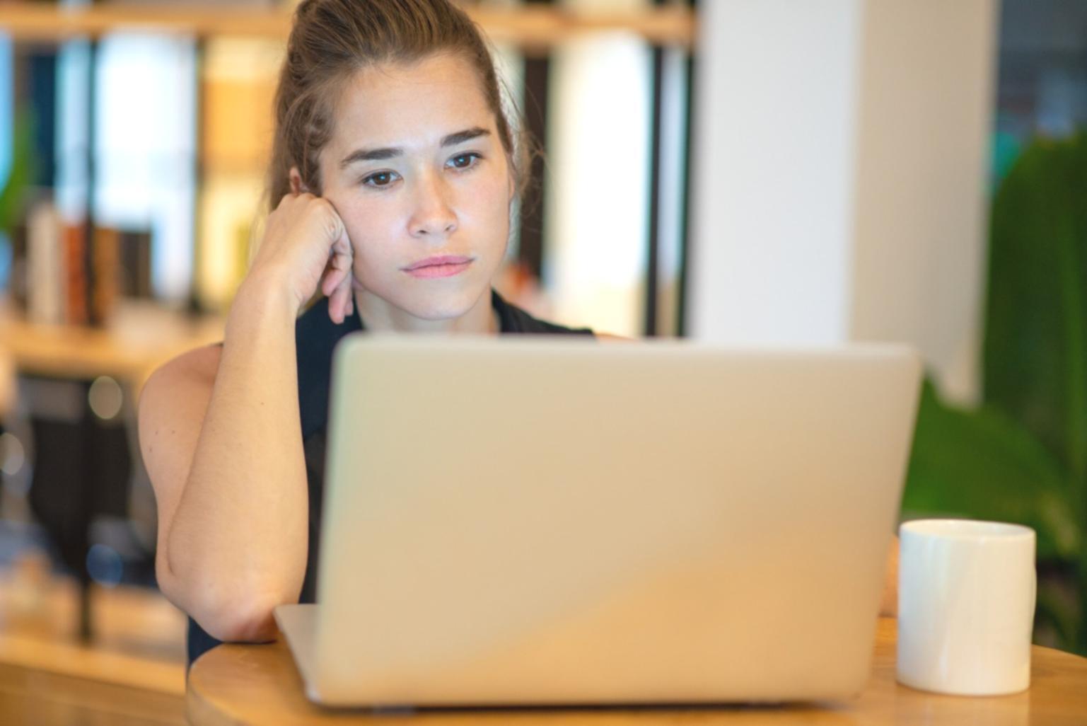 Developer working through physics simulation problems at a workstation